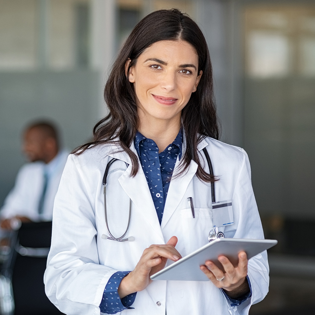 Smiling female doctor representing Sukoon's DHA health insurance plans and trusted care
